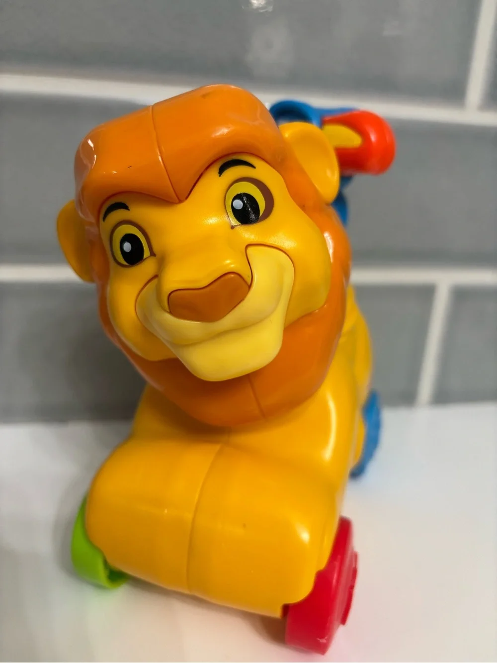 Fisher-Price Disney Baby Rollin' Tunes Mufasa push-along toy